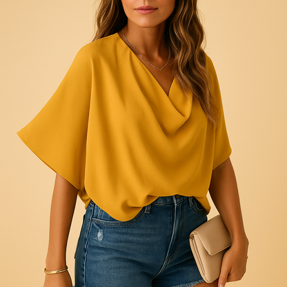 Women’s chiffon blouse with batwing sleeves and a v-neck, offering a relaxed fit for everyday wear, work, or casual outings.