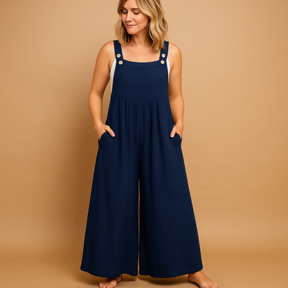 Woman wearing a loose-fit cotton overall with adjustable straps, designed for breathable comfort and casual summer outings.