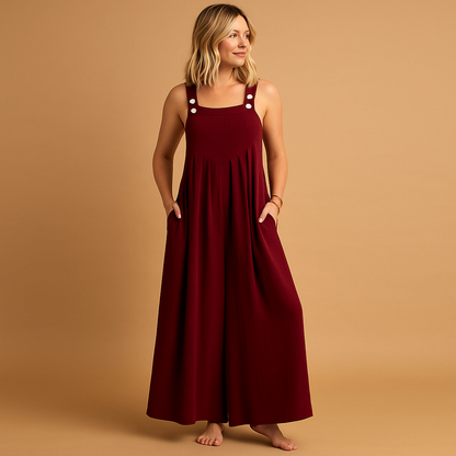Woman wearing a loose-fit cotton overall with adjustable straps, designed for breathable comfort and casual summer outings.
