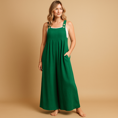 Woman wearing a loose-fit cotton overall with adjustable straps, designed for breathable comfort and casual summer outings.
