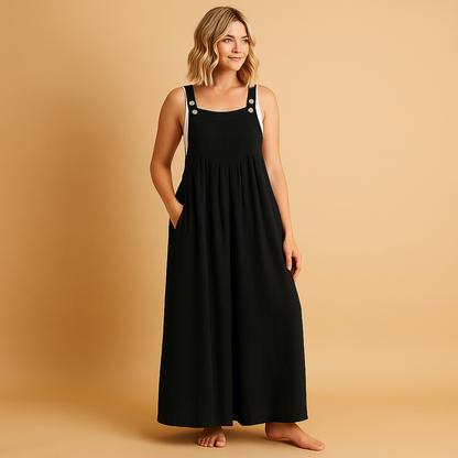 Woman wearing a loose-fit cotton overall with adjustable straps, designed for breathable comfort and casual summer outings.