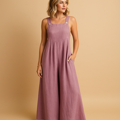 Woman wearing a loose-fit cotton overall with adjustable straps, designed for breathable comfort and casual summer outings.