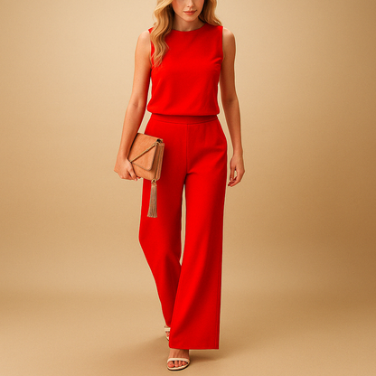 Woman wearing an elegant round-neck jumpsuit with a mid-waist fit and wide-leg design, suitable for work, evenings out, and special occasions.
