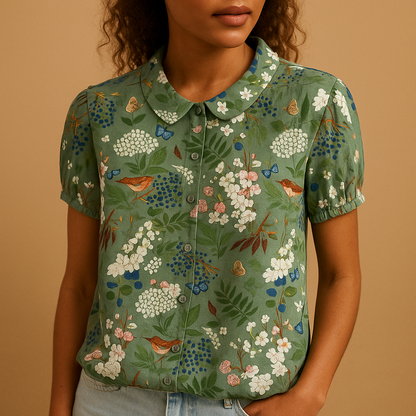 Women’s floral blouse with relaxed fit and breathable fabric, featuring a multicolor flower print for casual and warm-weather outfits.