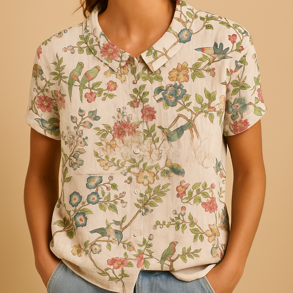 Women’s floral blouse with relaxed fit and breathable fabric, featuring a multicolor flower print for casual and warm-weather outfits.