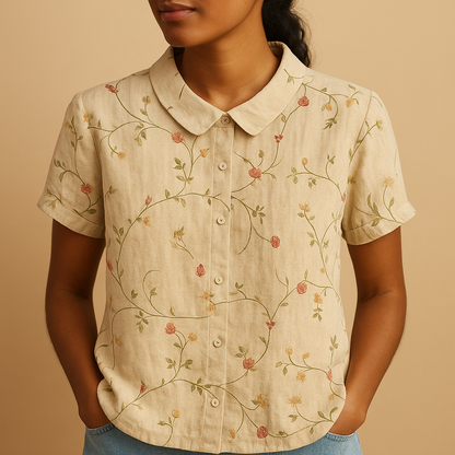 Women’s floral blouse with relaxed fit and breathable fabric, featuring a multicolor flower print for casual and warm-weather outfits.