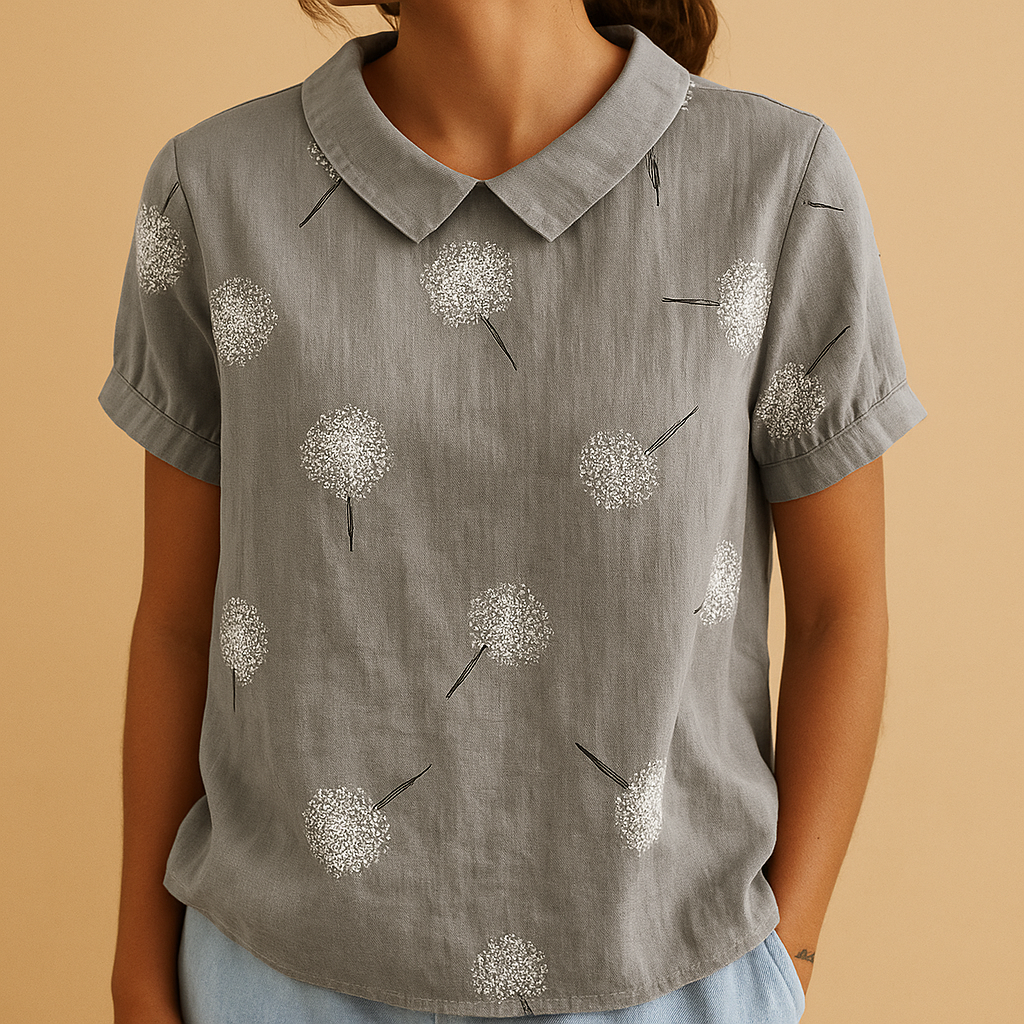 Women’s floral blouse with relaxed fit and breathable fabric, featuring a multicolor flower print for casual and warm-weather outfits.