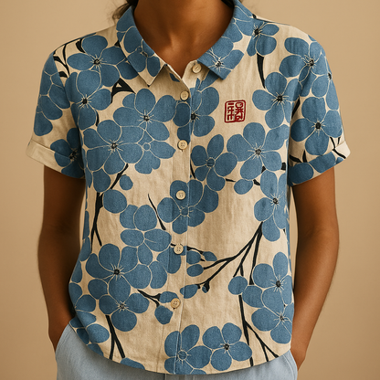 Women’s airy floral print blouse with a loose fit and breathable design, ideal for casual wear on warm days indoors or outdoors.