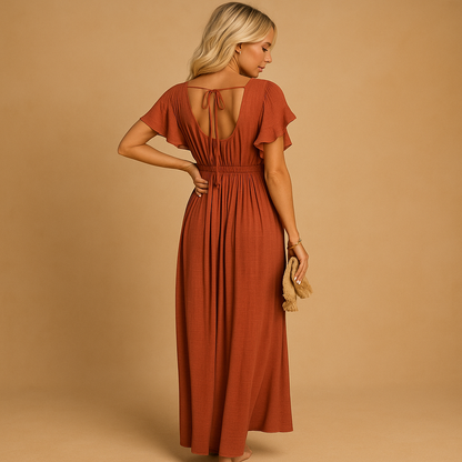 Flowy beach cover up dress for women in orange cotton blend fabric, ideal for wearing over swimwear at the beach, pool, or during summer vacations.