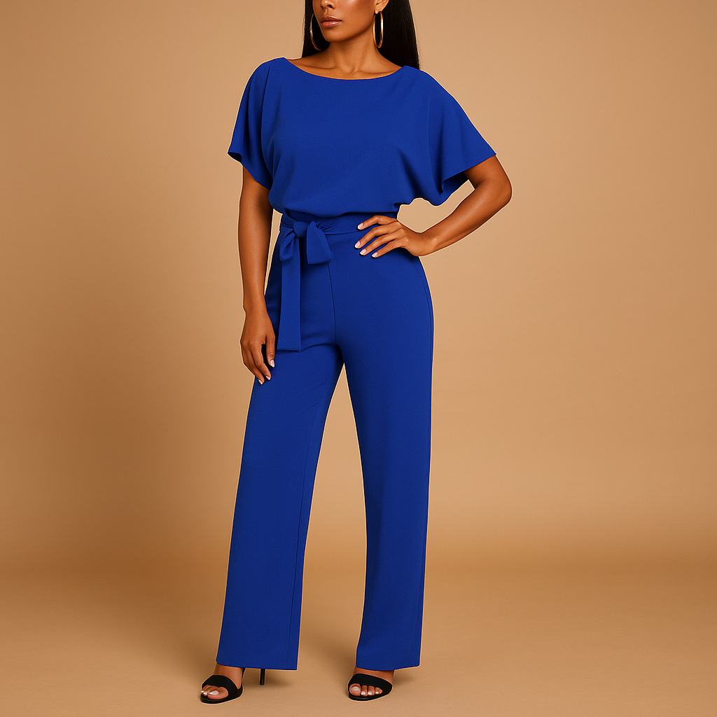 Woman wearing a glitter halter jumpsuit with an open back and flared legs, perfect for galas, parties, and festive occasions.