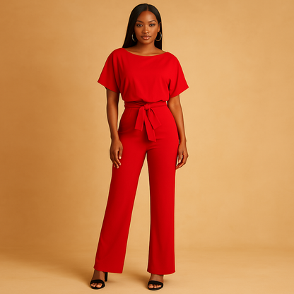 Woman wearing a glitter halter jumpsuit with an open back and flared legs, perfect for galas, parties, and festive occasions.