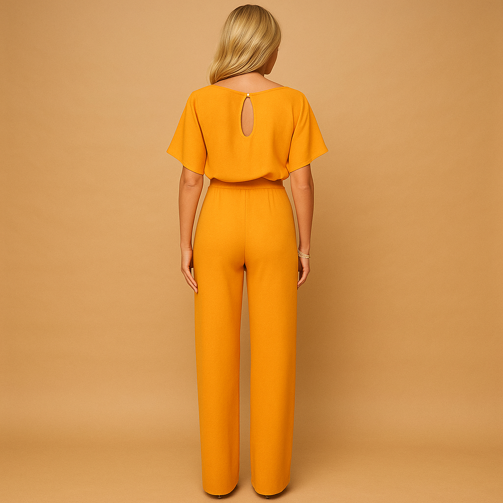 Woman wearing a high-waist lace-tie jumpsuit with a flattering tailored fit and soft draping fabric, suitable for work, evenings out, and chic casual occasions.