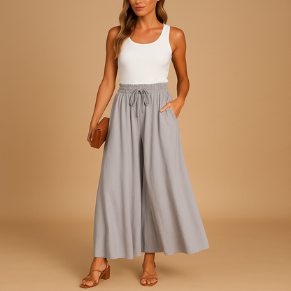 High waist wide leg trousers for women with elastic waistband and elegant silhouette, ideal for work outfits, casual looks, and modern everyday style.