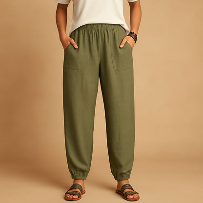 High-waisted boho summer trousers for women with a loose flowing fit and functional pockets, ideal for beach days, travel, and relaxed summer outfits.