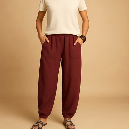 High-waisted boho summer trousers for women with a loose flowing fit and functional pockets, ideal for beach days, travel, and relaxed summer outfits.