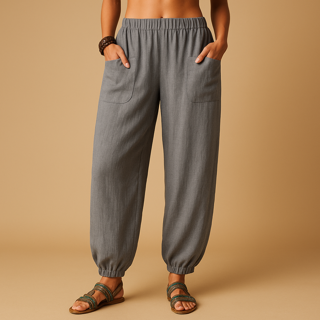 High-waisted boho summer trousers for women with a loose flowing fit and functional pockets, ideal for beach days, travel, and relaxed summer outfits.