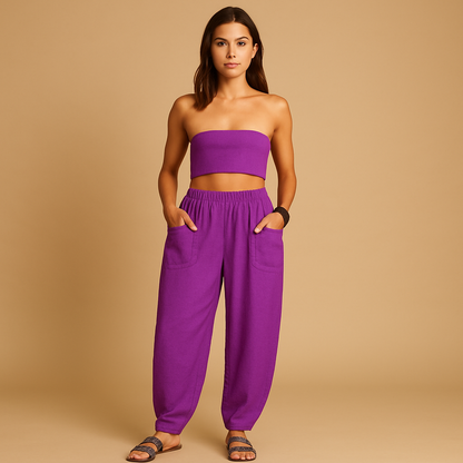 High-waisted boho summer trousers for women with a loose flowing fit and functional pockets, ideal for beach days, travel, and relaxed summer outfits.