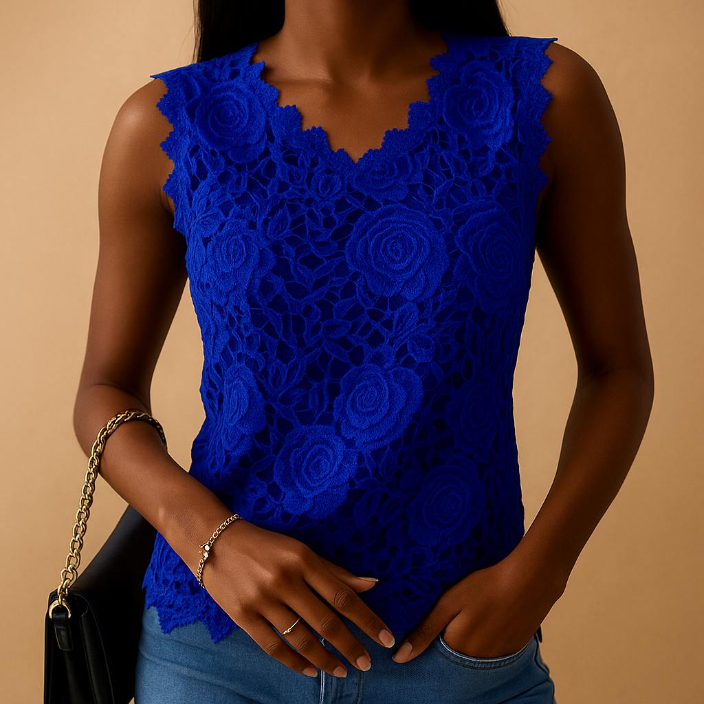 Women’s lace blouse with relaxed fit and round neckline, featuring elegant lace details in multiple colors.