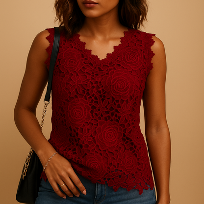 Women’s lace blouse with relaxed fit and round neckline, featuring elegant lace details in multiple colors.