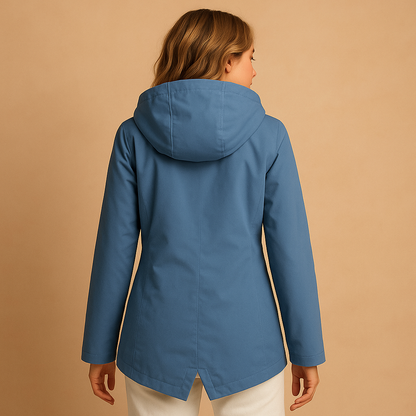 Women’s long waterproof raincoat with hood, breathable fabric, and lightweight design for stylish everyday rain protection.