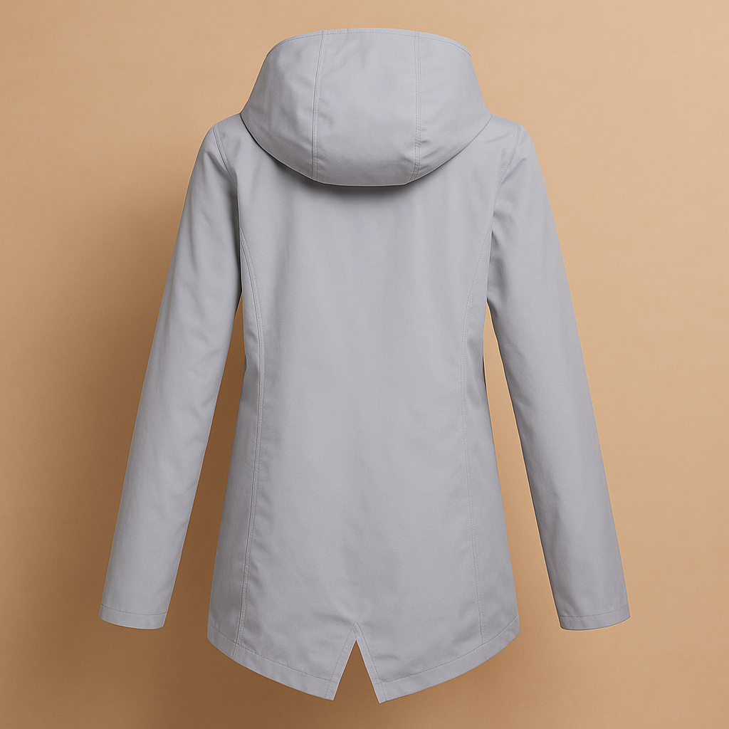 Women’s long waterproof raincoat with hood, breathable fabric, and lightweight design for stylish everyday rain protection.