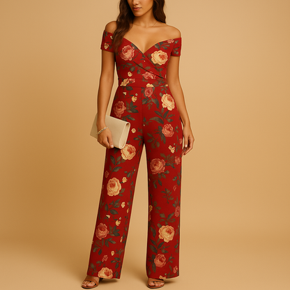 Woman wearing an off-shoulder floral jumpsuit with a tailored silhouette and blue-red print, ideal for weddings, ceremonies, and summer events.