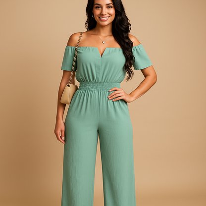 Woman wearing an off-shoulder pleated jumpsuit with an elastic waist, perfect for summer events, beach days, and casual chic outfits.