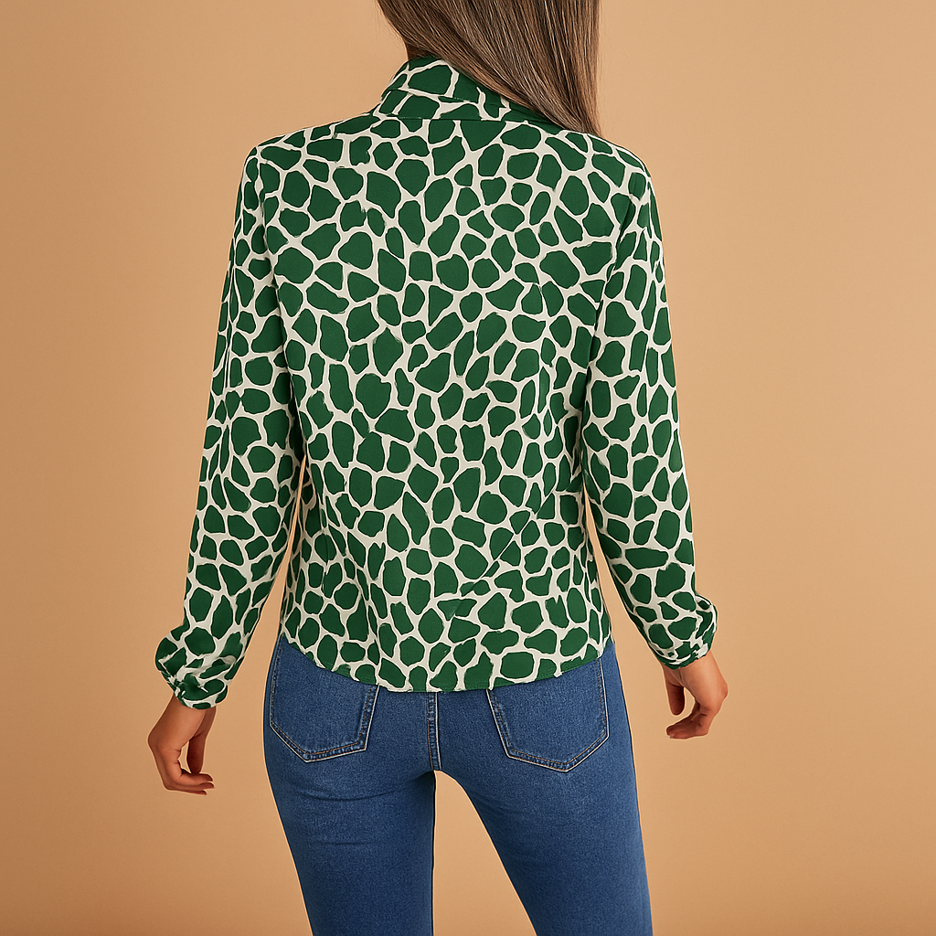 Polka dot blouse for women with a bow detail, regular fit, and elastic cuffs, suitable for work outfits and everyday wear.