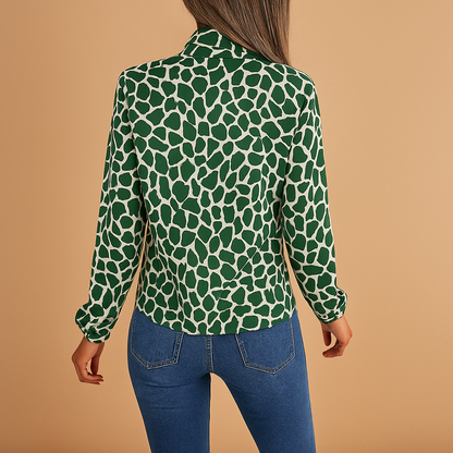 Polka dot blouse for women with a bow detail, regular fit, and elastic cuffs, suitable for work outfits and everyday wear.