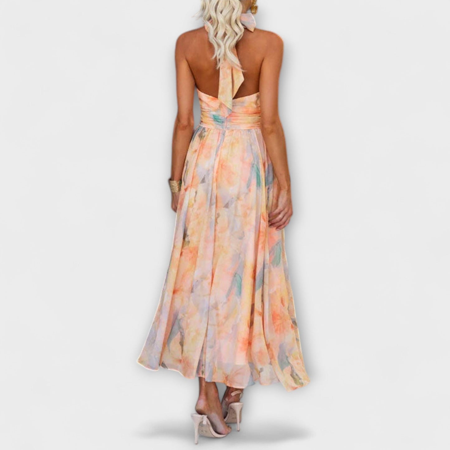 Woman wearing a floral dress on a white background