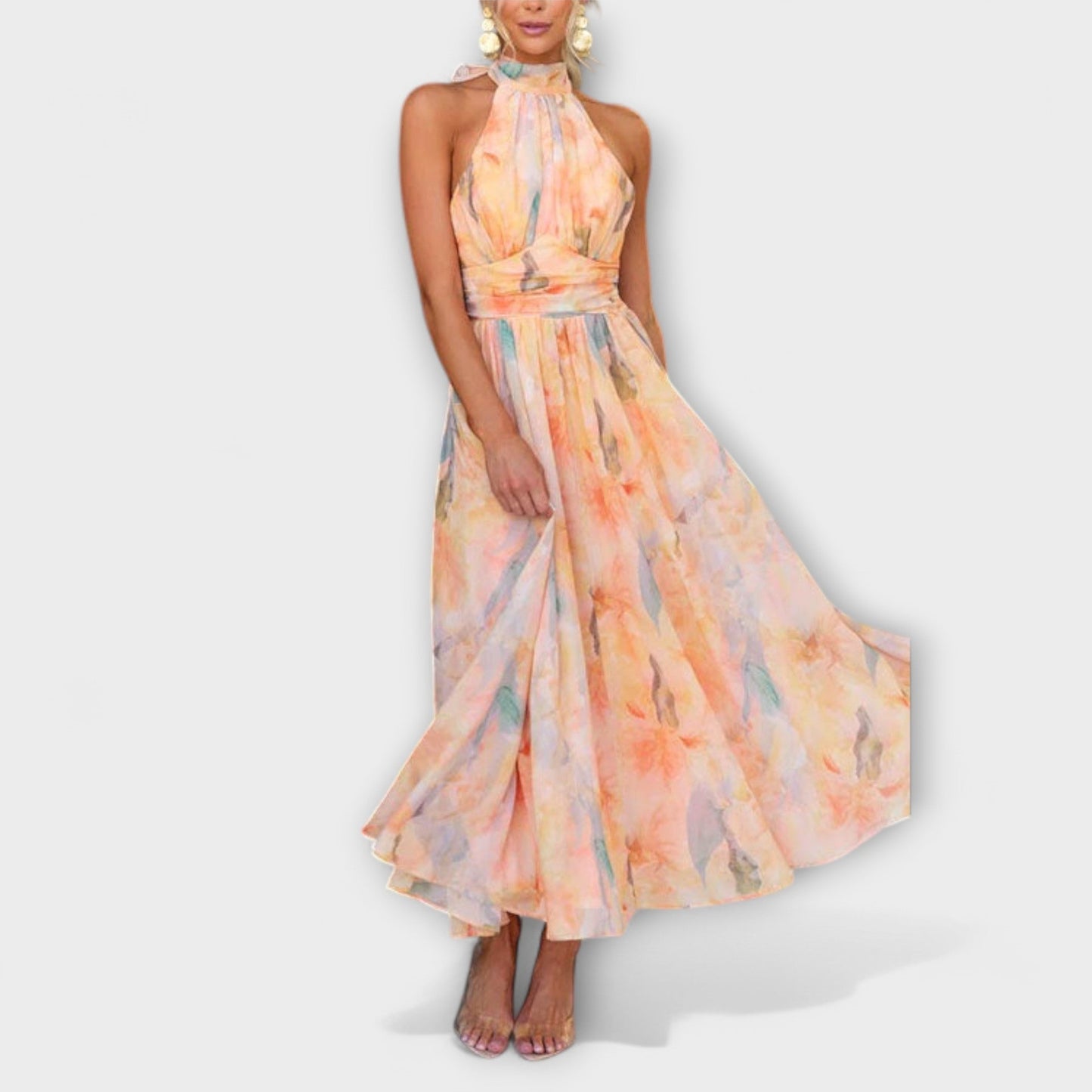 Woman wearing a floral maxi dress on a white background