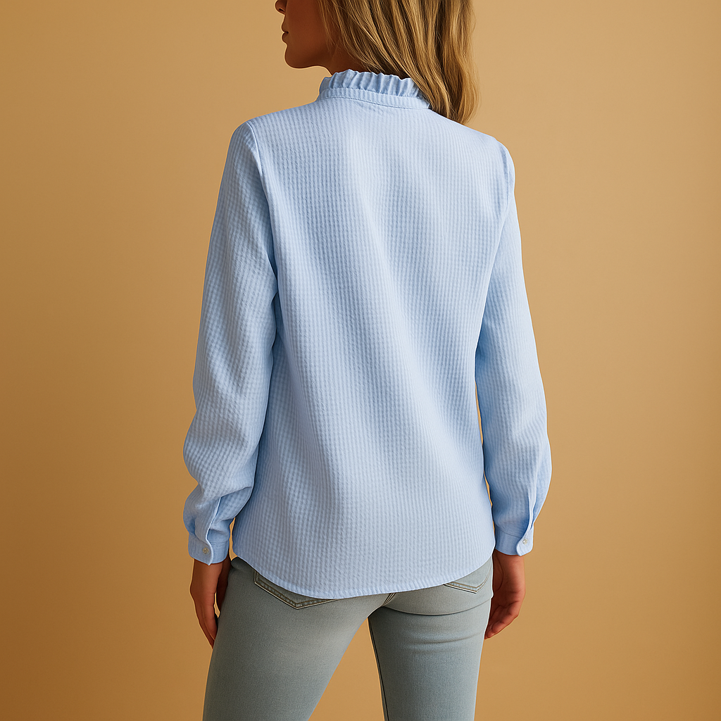Women’s striped blouse with ruffles and button details in a lightweight, soft design, ideal for everyday wear and dressed occasions.