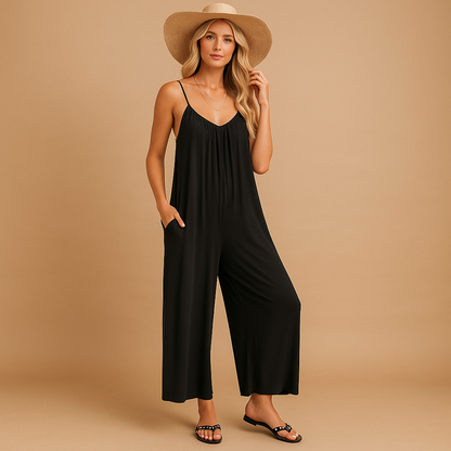 Woman wearing a loose summer jumpsuit with adjustable straps and an elastic waistband, ideal for holidays, parties, and warm days.