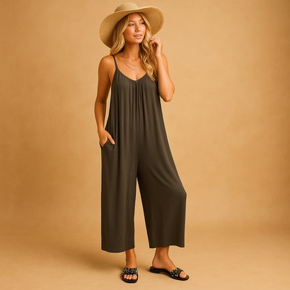 Woman wearing a loose summer jumpsuit with adjustable straps and an elastic waistband, ideal for holidays, parties, and warm days.