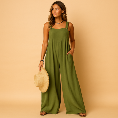 Woman wearing a high-waist wide-leg summer jumpsuit with button details and side pockets, perfect for warm casual days.