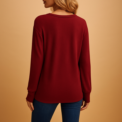 Women’s v-neck blouse with button details and a loose, comfortable fit, suitable for daily wear, office outfits, and versatile styling.